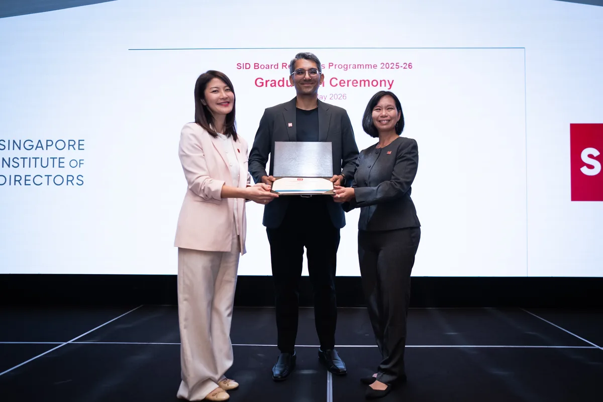 Dhawal Shah receiving his certificate from SID CEO Emily Poon and former SID Chairman Su-Yen Wong at the Singapore Institute of Directors Board Readiness Programme graduation ceremony, May 2026