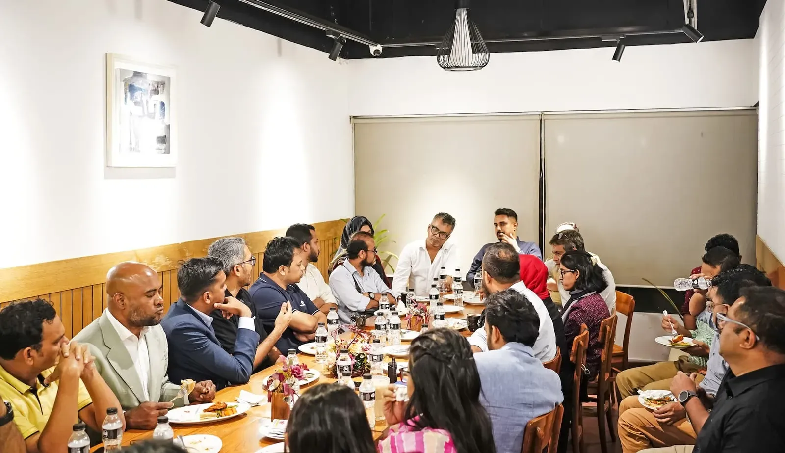 Sharing session around a roundtable to marketers in Dhaka